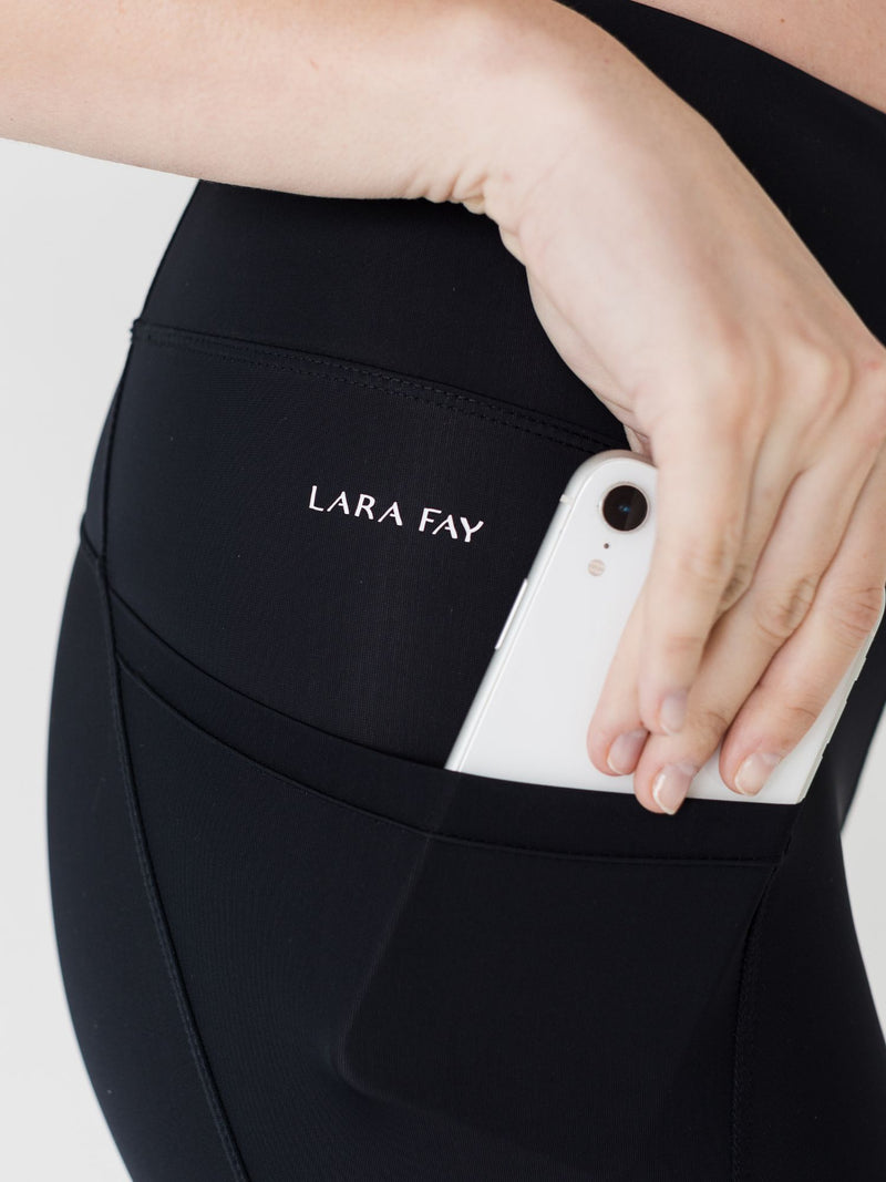 black long workout legging with pockets on both sides and at the back. 