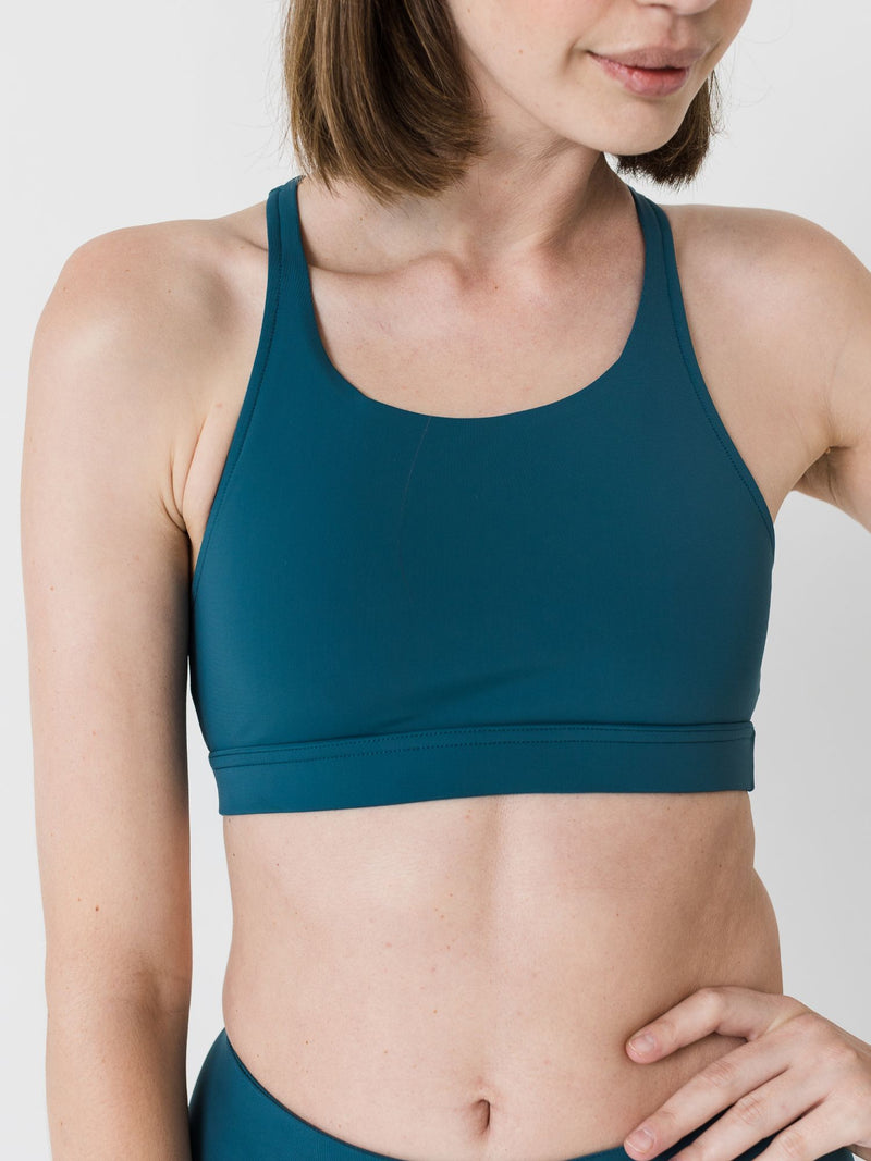 green racerback sports bra for pilates and yoga