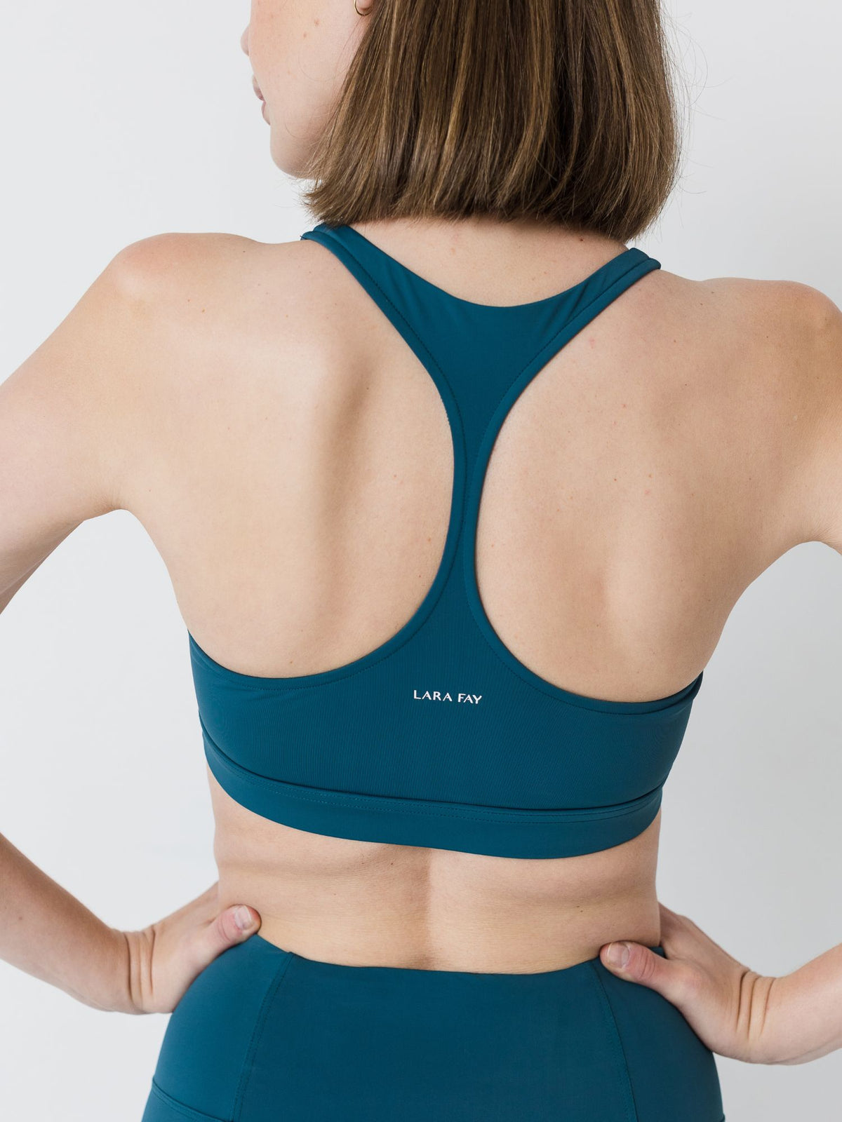 green racerback sports bra for pilates and yoga