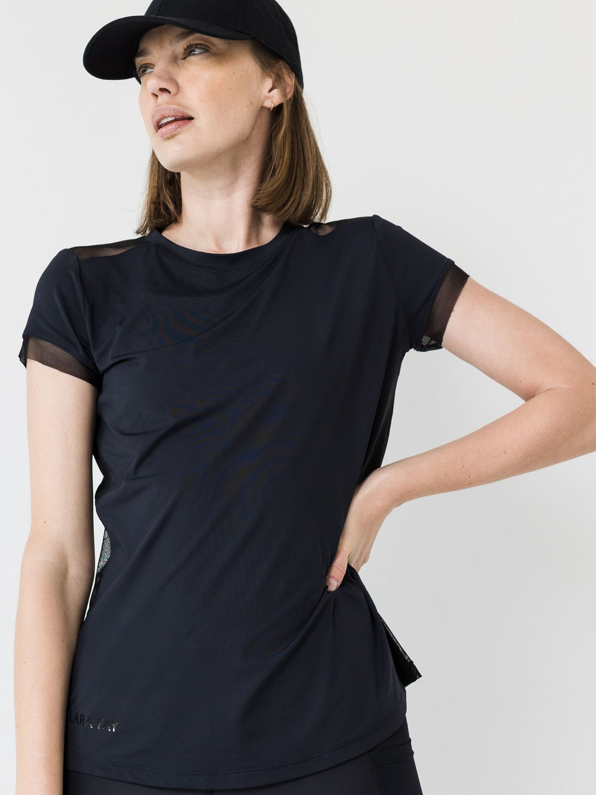 soft black running tee with mesh panels and sleeves